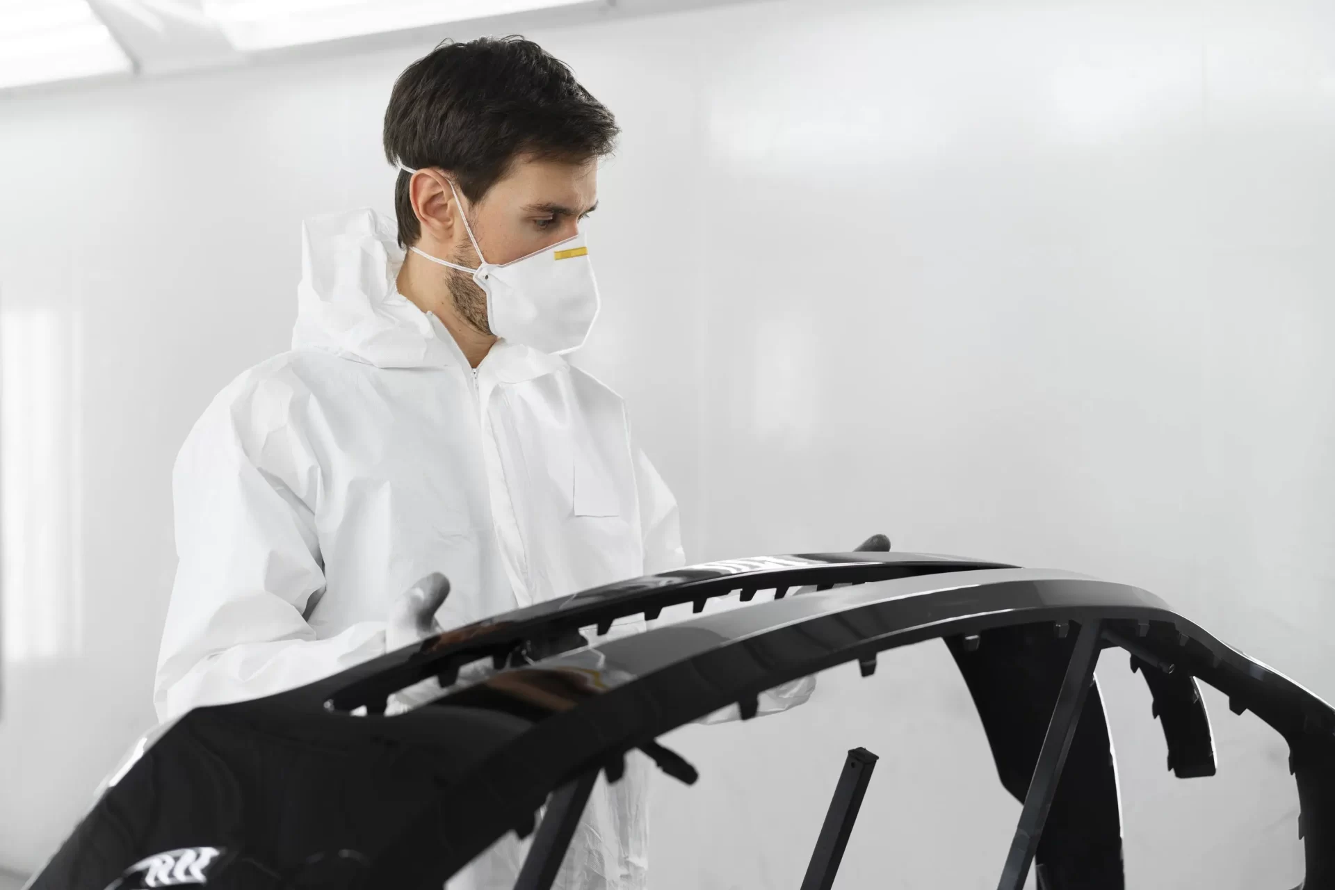 male-painter-hazmat-suit-inside-car-shop_web.webp